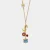 Collana in Metallo con campanella a forma di orsetto blu e piccola margherita, luna e cuore 3541400