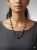 Collana artigianale in legno intagliato e inserti dorati Maison MTG